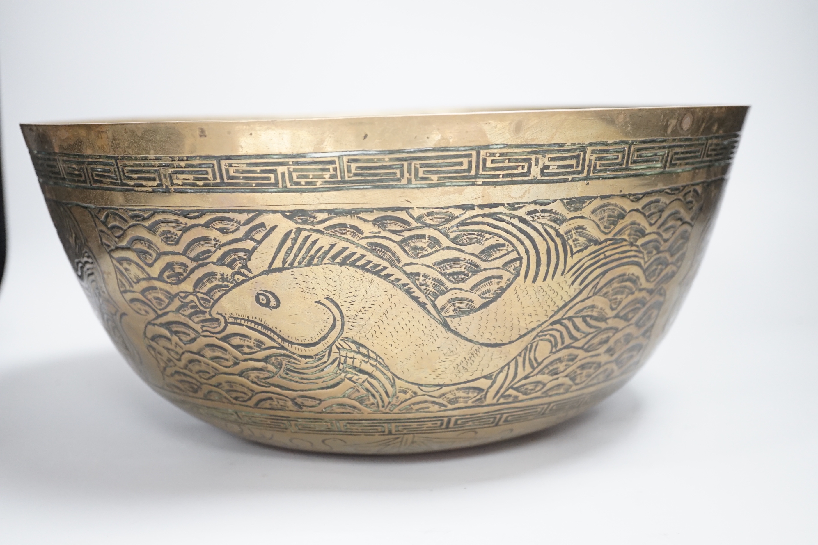 A Chinese brass ‘dragon’ engraved bowl, early 20th century, 33cm diameter